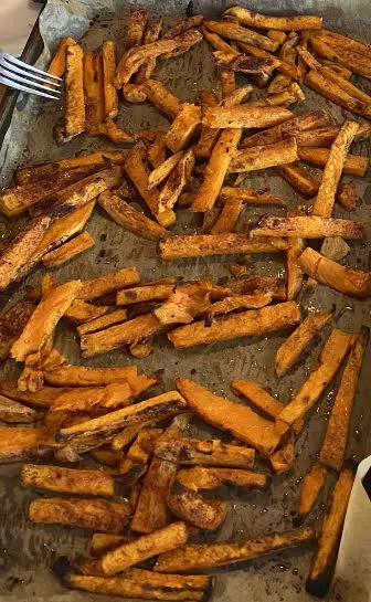 cooked sweet pototo fries in pan
